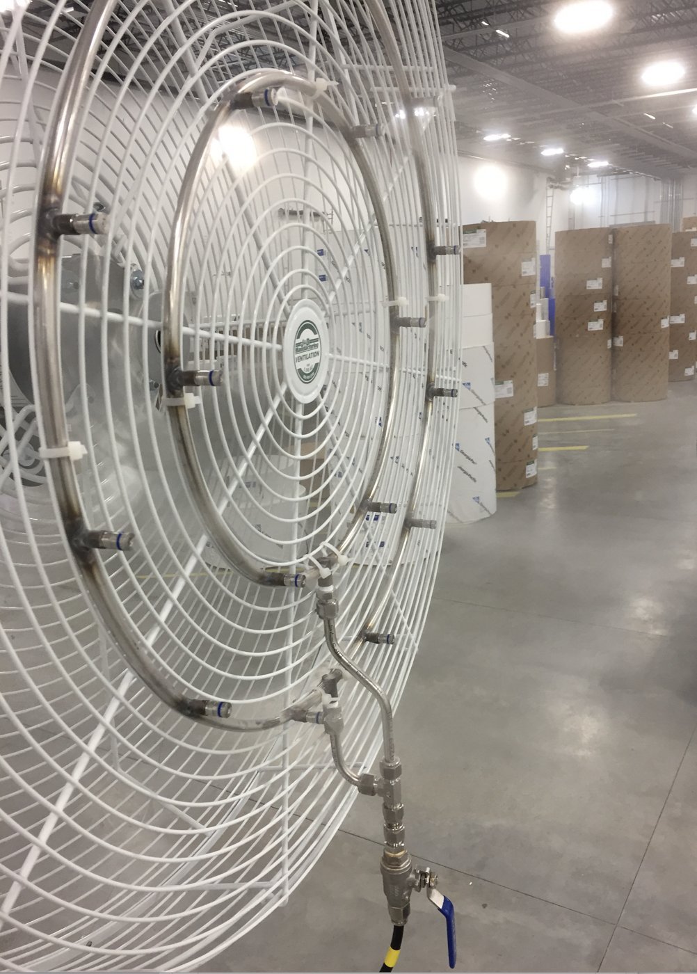 Two stainless mist rings on the front of a 36-inch fan